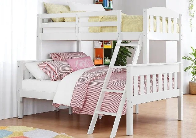 DHP Airlie Twin Over Full Bunk Bed featuring a wooden frame with a dark espresso finish, twin-size top bunk and full-size bottom bunk, complete with integrated ladder and safety guardrails, styled in a modern kids’ bedroom.